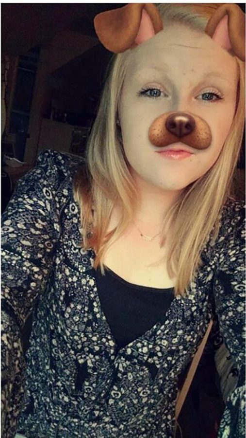Sophomore Grace Poeppel using the classic snapchat dog filter as she is enjoying the warm weather and the stylish clothes that come with it.