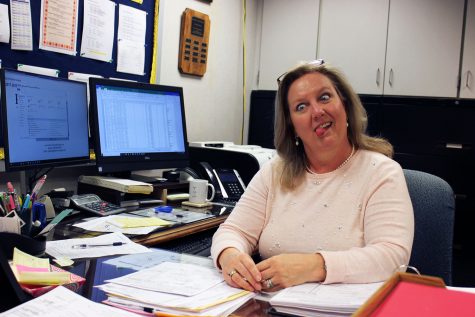 Mrs. Kovach makes a silly face after doing extremely important stuff on her two computers.