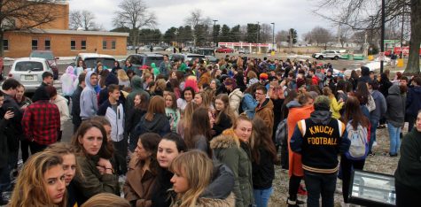 Students outside by the flagpole on March 14th for the walk out. 