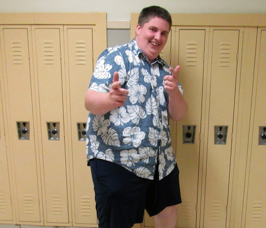 Junior Zachary Thompson shows off one of his various tropical shirts