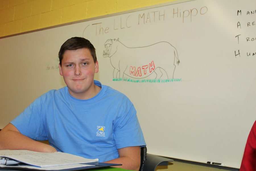  A slightly disturbing “LLC Math Hippo” drawing looms over students as they try to do their math homework during tutoring this Wednesday, but junior Michael Kohl bravely continues his pre-calculus without getting distracted.  How does he do this with such ease, you may ask? “I make my face as weird as the hippo,” he says, looking at its gaping mouth.  “I am ONE with the hippo.”