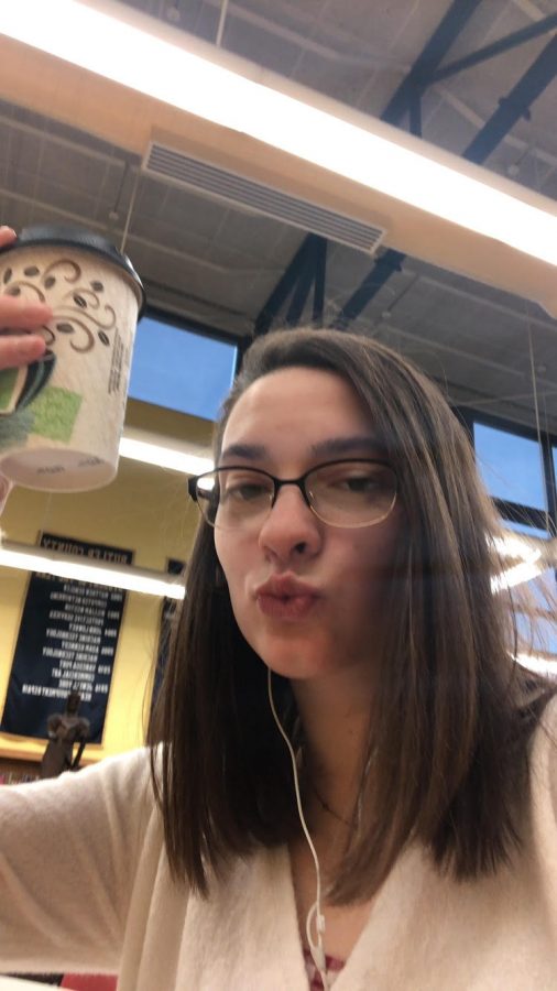Junior Rory McCune shows off model moves with her coffee from our very own, Knoch Off Coffee Shop