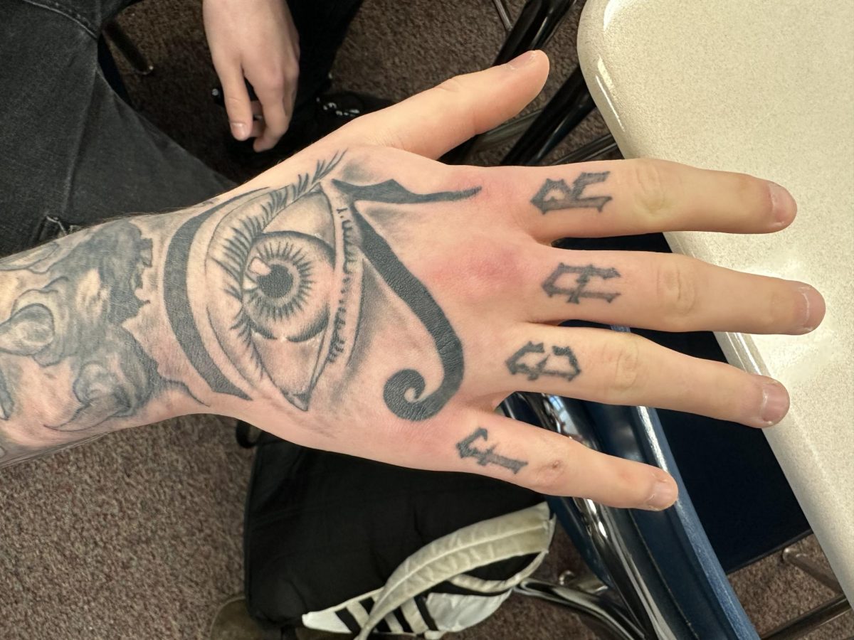 Senior John Weisensee has had the two tattoos he shared with me for approximately three months, although he has acquired quite a few others over the span of the past few months. His two that mean the most to him are  the eye of horus he has on his hand, and the dagger he has on his arm. Weisensee rates the eye as an 11/10 on the pain scale due to the placement and dark shading. Totally worth it though, as it goes very well with his other tattoos and is quite mysterious. 
“The eye of horus is a very powerful symbol in egypt,” said Weisensee. “Eyes are powerful to people, you can learn a lot from someone by looking in their eyes.”

